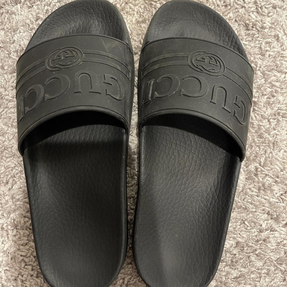 Black rubber authentic Gucci slides